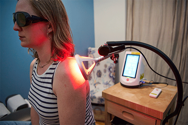 Woman receiving Cold Laser Therapy for shoulder pain in Red Hook, NY